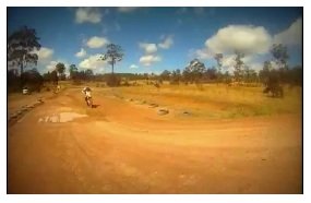 riding a motocross track on a dirtbike